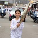 Noahm Bloutin porte la flamme olympique